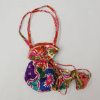 Pre Order: Halter Neck Heavily Embroidered Top And Lehenga With Dupatta And Potli Bag